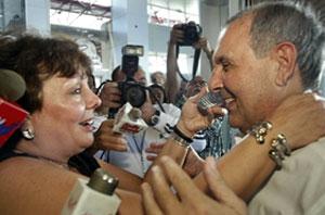 WELCOME: Talk-radio host Ninoska Perez Castellon greets Guillermo Novo at Opa-locka Airport on Thursday. RAUL RUBIERA/HERALD STAFF