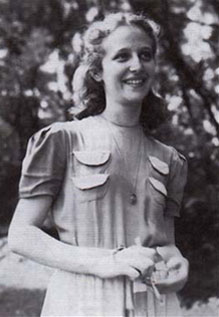Janet Rosenberg as a young woman, smiling and standing outside.